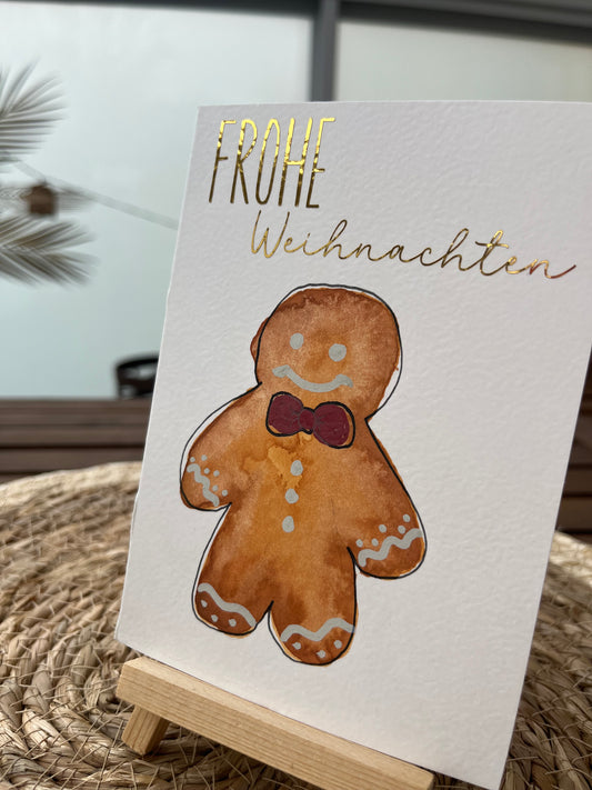 Weihnachtskarte mit Lebkuchenmann und goldener Schrift